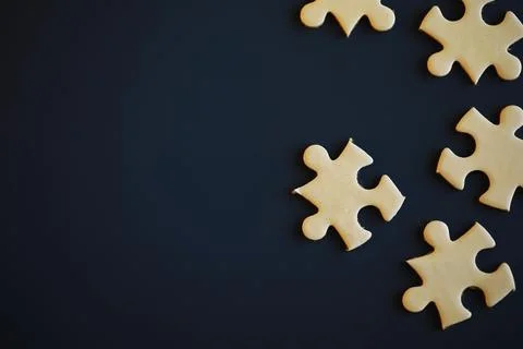 Clean puzzle elements on the background. Empty puzzle piece on the table. T.. Stock Photos