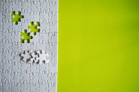 Clean puzzle elements on the background. Empty puzzle piece on the table. T.. 스톡 사진