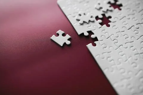 Clean puzzle elements on the red background. Empty puzzle piece on the tabl.. Stock Photos