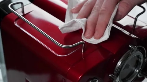 Clean a red coffee machine with a napkin Stock Footage 165212282