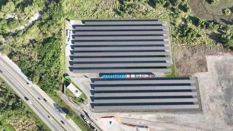 Clean, renewable solar energy. Located near a highway and cars, Aerial View 스톡 동영상 343742538