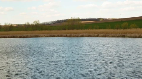Clean river on field and sky background Stock Footage 129038072