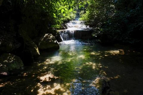 Clean river with mini waterfall, cool environment, cozy place Stock Photos