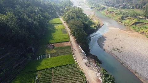A clean river with a path along the river Stock Photos