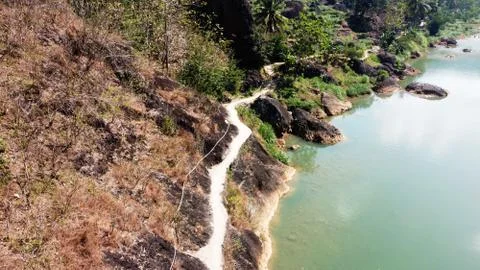 A clean river with a path along the river Stock Photos