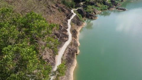 A clean river with a path along the river Stock Photos
