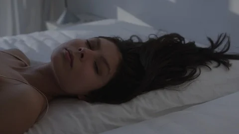 Clean Sensual Package 29 | dramatic woman sleep lay in bed looking into camera Stock Footage 116770499