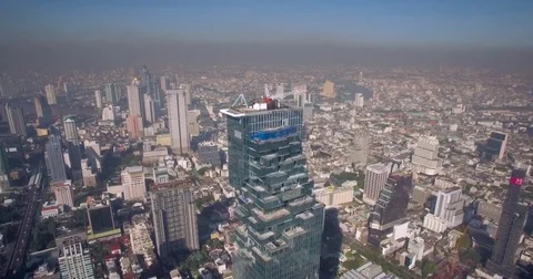 Clean Sky Over Silom District in Central Bangkok, Aerial Pullback Shot Stock Footage 73312639
