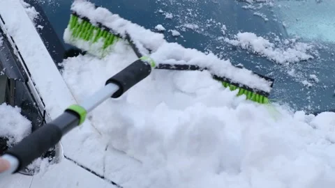 Clean snow from the car. Video stock 218709408