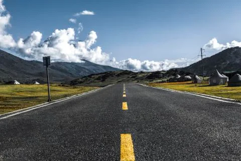 A clean straight road outside Stock Photos