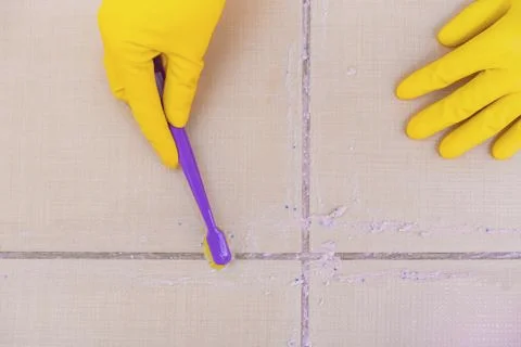 Clean the tiles on the floor. Stock Photos