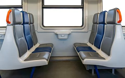 Clean Train Carriage Interior with Modern Seating Design Stock Photos