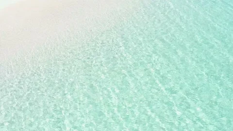 Clean transparent blue sea waves on a white sand beach. Stock Footage 161445945