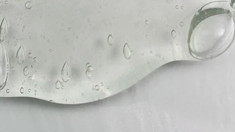 Clean transparent shampoo with bubble flowing from bottom. Macro cosmetic, cl Video stock 199824422