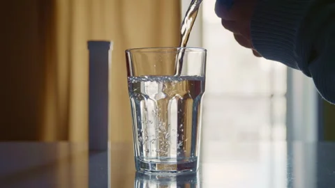 Clean Transparent Water Poured into Drinking Glass at Home Vidéo 332888560