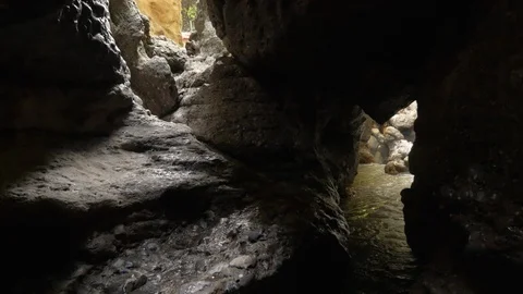 Clean underground river flows in a canyon 動画素材 130100106