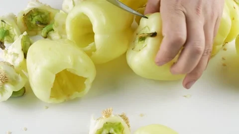 Clean the vegetables and cut the core from the pepper. Stock Footage 136740467