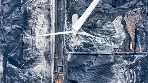 Clean vs dirty energy. Wind turbines against fuel coal power plant. Sustain.. Stock Footage 231484802