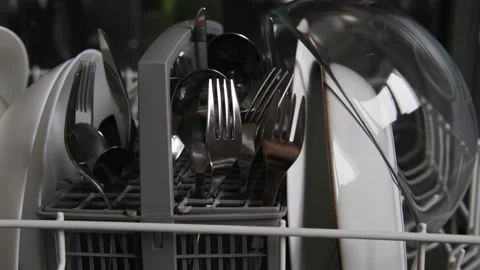 Clean washed dishes in the dishwasher Stock Footage 168424215