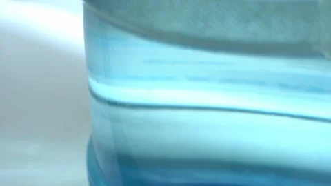 Clean washed plastic bottle of 19 liters, bottom is clean with drinking water Vídeo Stock 239610665