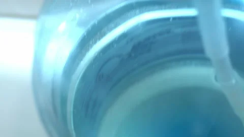 Clean washed plastic bottle of 19 liters, bottom is clean with drinking water Vídeo Stock 239610669