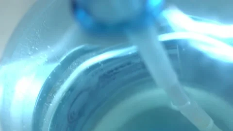 Clean washed plastic bottle of 19 liters, bottom is clean with drinking water Vídeo Stock 239610671