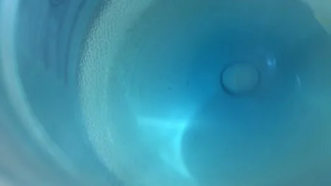 Clean washed plastic bottle of 19 liters, bottom is clean with drinking water Vídeo Stock 239610701