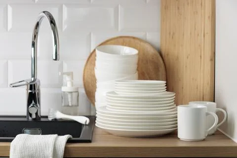 Clean washed tableware. Concept of washing dishes. Dishwashing liquid with br Stock Photos