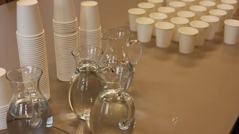 Clean water and cups on the table Stock Footage 286041106