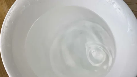 Clean water fall down in plate, water crown, super slow motion Stock Footage 149043803