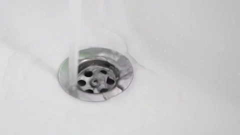 Clean water flowiing through the sink Stock Footage 136097089