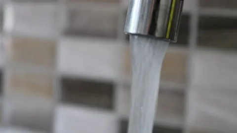 Clean water flowing from the tap in the kitchen Stock Footage 135441497