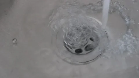 Clean water flowing through the kitchen sink Stock Footage 135764756