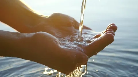 Clean water in hands - a powerful visual of the ecological crisis. Ideal for Stock Footage 320170521