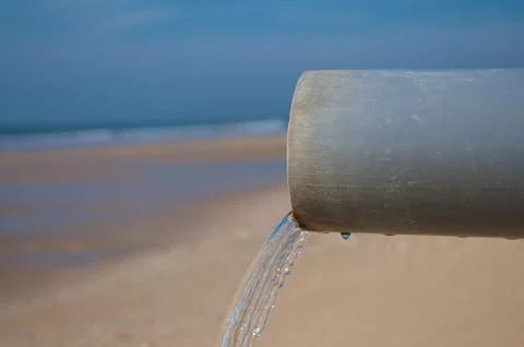Clean water pipe at a beach Stock Photos
