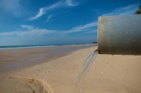 Clean water pipe at a beach Stock Photos