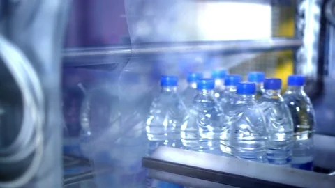 Clean water in plastic bottle moves through conveyor factory. Stock Footage 86196444