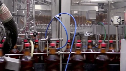 Clean water in plastic bottle moves through conveyor factory. Mineral Water Stock Footage 334587457