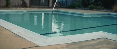 Clean water in swimming pool with edge and ladder Stock Footage 315920169
