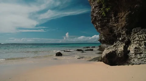 Clean white beach with a cliff - Geger beach, Bali Video stock 63591243