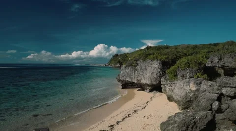 Clean white beach secluded with cliffs viewed from above - Geger beach, Bali Stock Footage 63659827