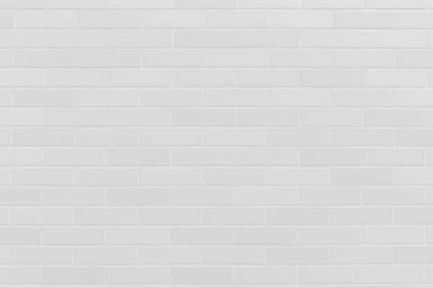 Clean white brick wall pattern tile for interior construction background Stock Photos