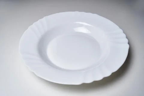 Clean white plate without patterns Photos