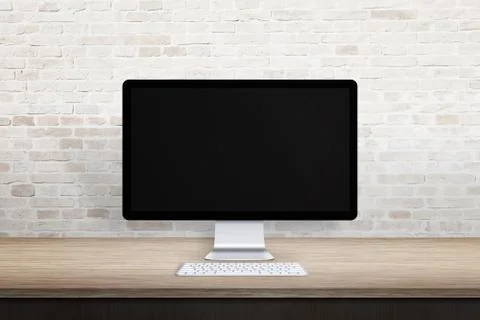 Clean workplace with computer display. Blank screen for web site promotion. E Stockfoto's