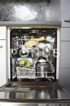 Cleaned Dishes In Open Dishwasher