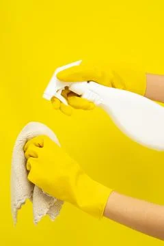 Cleaner concept, Hand in rubber gloves and holding spray bottle to spray cl.. Stock Photos