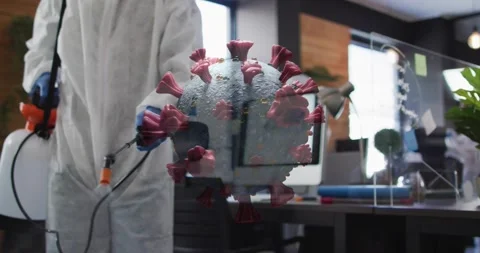Cleaner entering office spraying plexi shields and desks for health on rotating Video stock 321161538