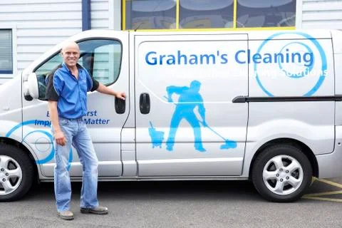 Cleaner standing next to van Stock Photos