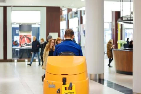 Cleaner at the sweeper in the mall Stock Photos