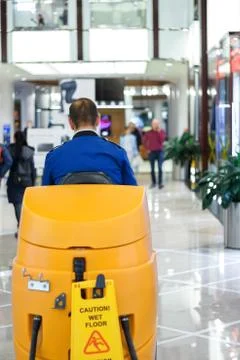 Cleaner at the sweeper in the mall Stock Photos